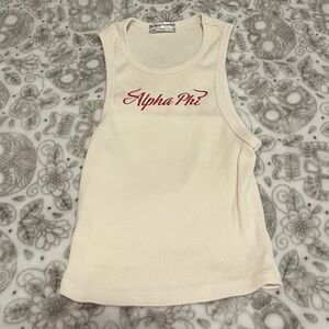 Creme Alpha Phi tank top with “Alpha Phi” in red